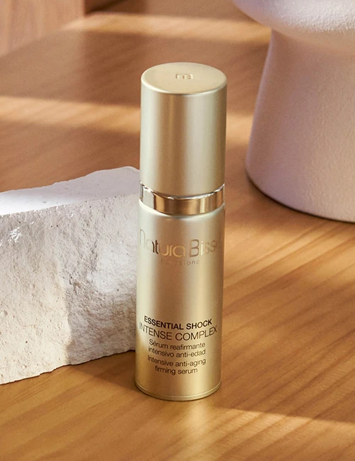 Essential Shock Intense Complex on top of wooden table. Product featured in our bestsellers page.