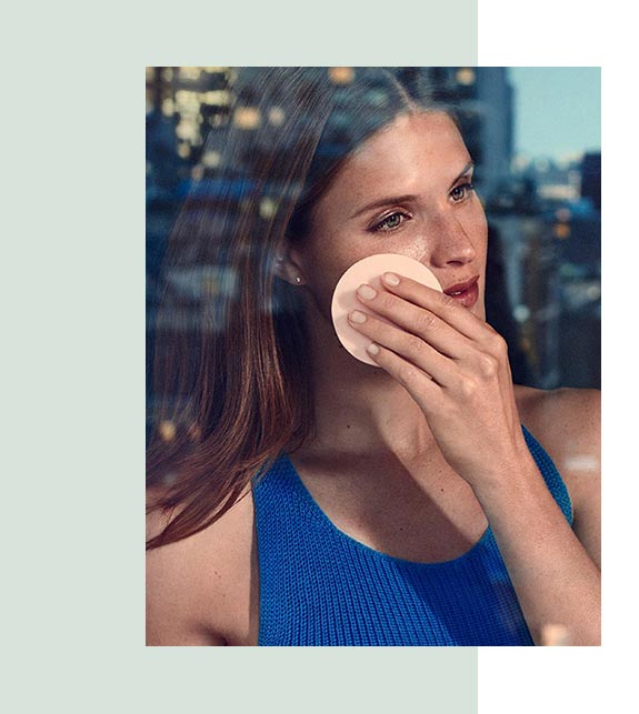 Woman applying cleanser with sponge